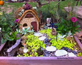 Fairy cottage miniature garden by Shirley Bovshow with stone house, succulent room and mini garden decor